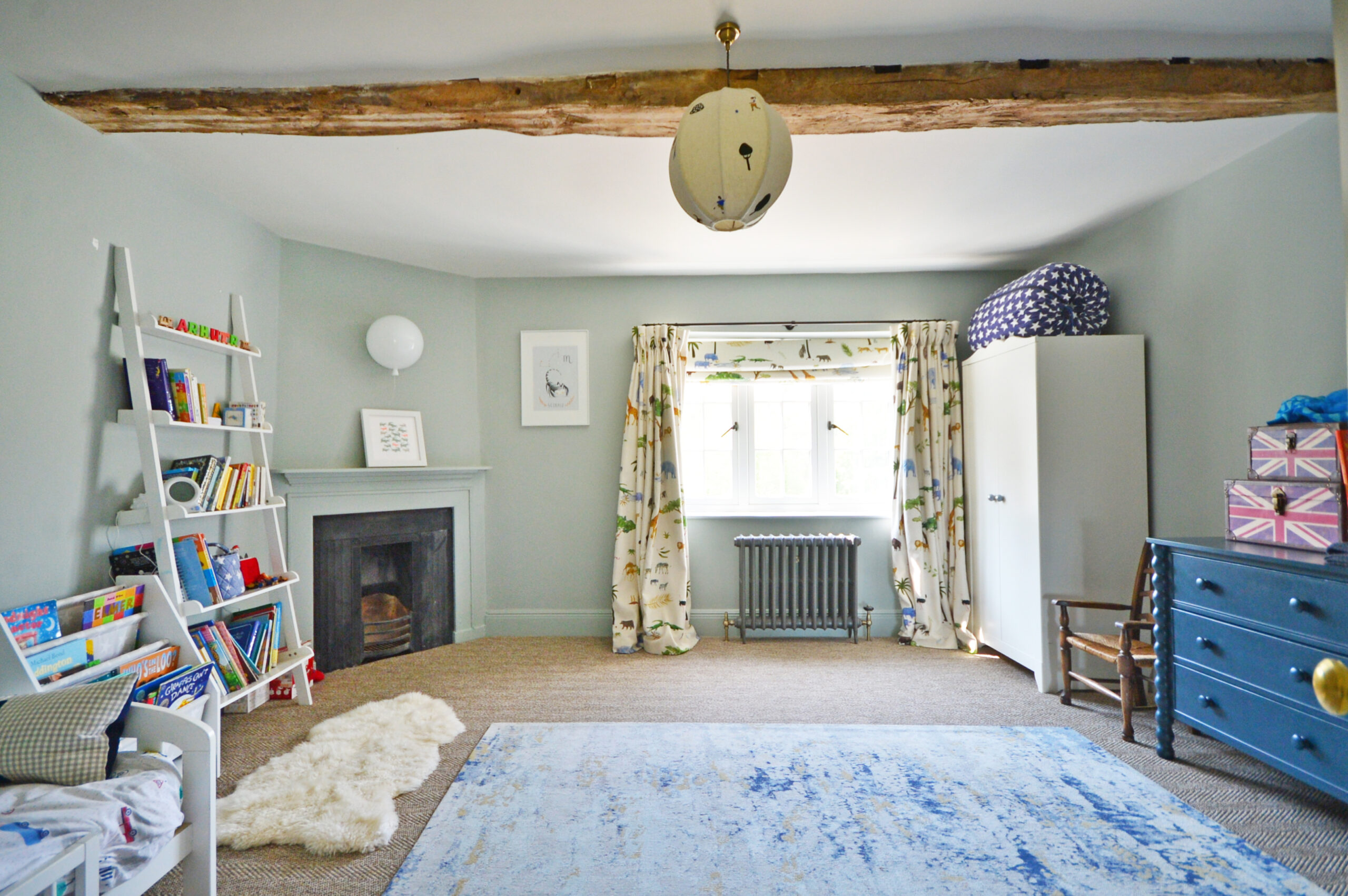 Classic timeless children's room with fireplace brings warmth and cosy vibes to this character property and original features.
